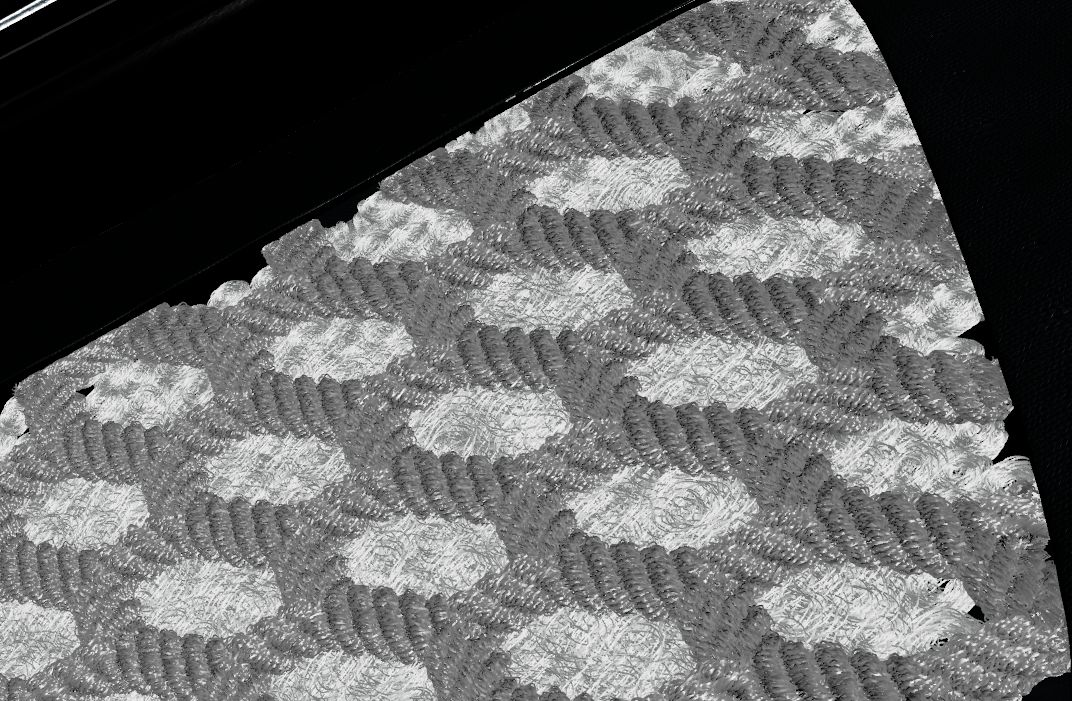 Grey untextured render of a knitted shoe panel on black: rows of fine fibres forming a raised hexagonal pattern.
