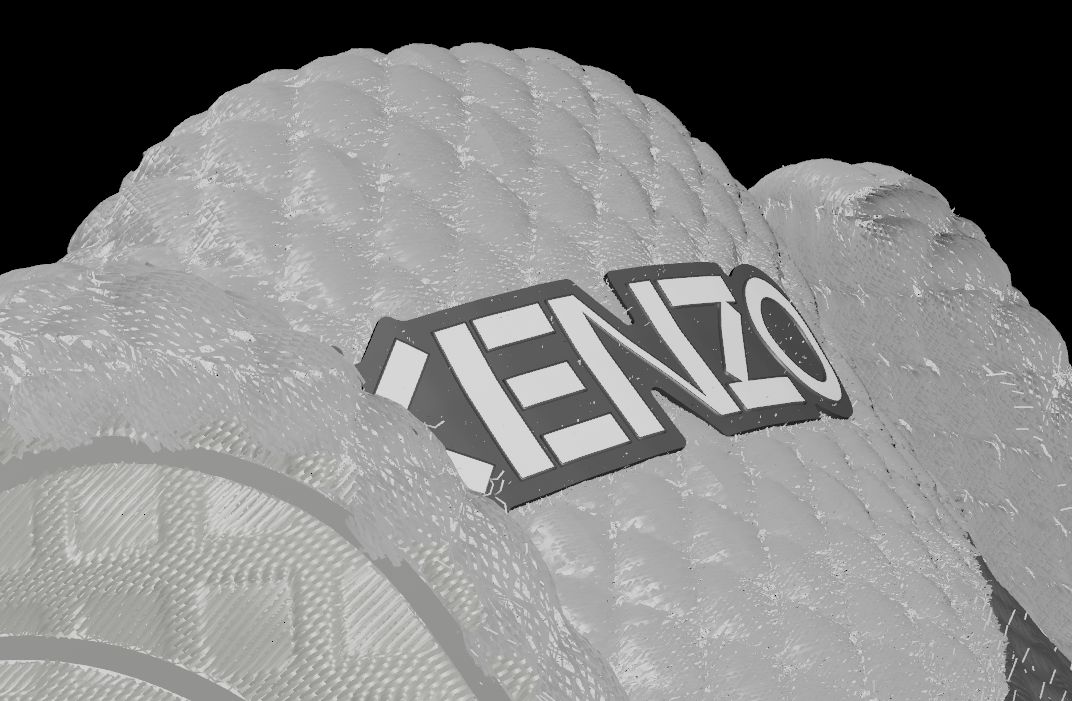 Grey untextured render of a knitted heel covered in small raised stitches, with a KENZO label in relief.