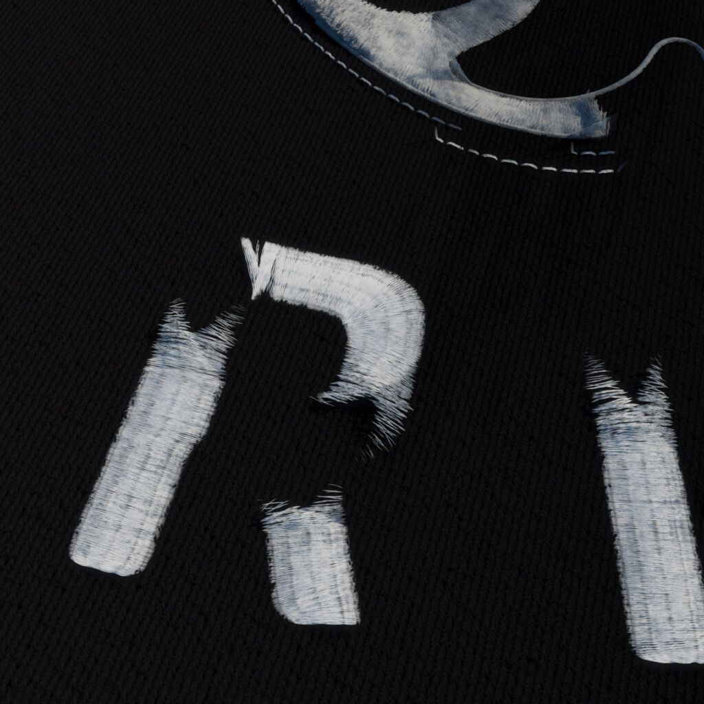 Black knitted fabric with partly formed white stitched letters whose edges fray into loose fibres, below a curved white shape edged with dashed stitching.