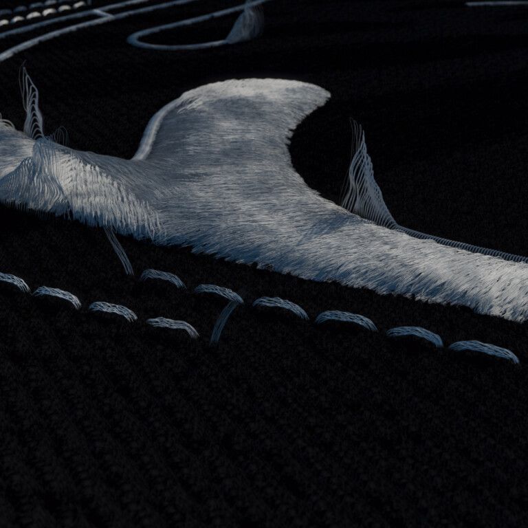Low-light close-up of black knit with a raised white fibrous shape and a row of white stitches, loose strands rising from its edges.